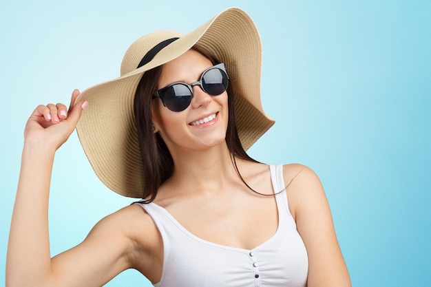 Young pretty woman in a straw hat