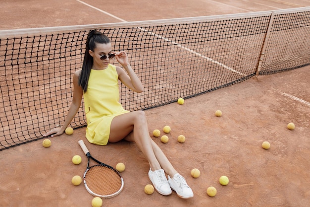 young pretty woman tennis fashion