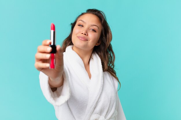 Young pretty woman wearing bathrobe