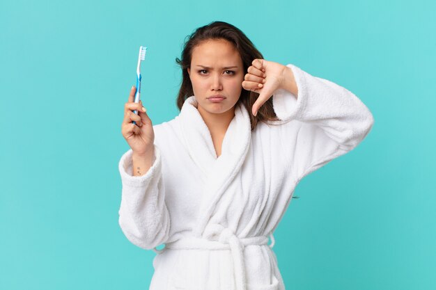 Young pretty woman wearing bathrobe