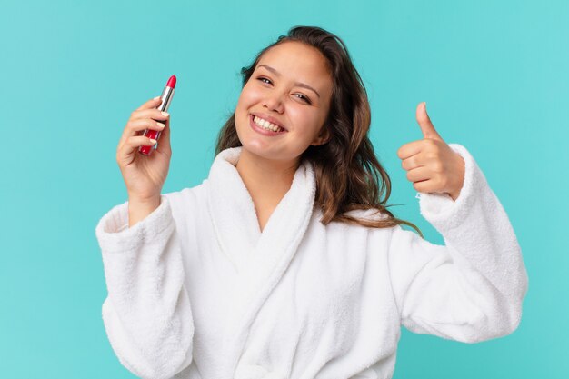 Young pretty woman wearing bathrobe