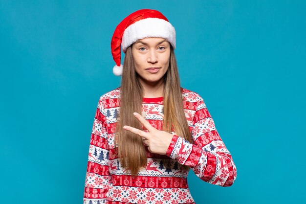 Young pretty woman wearing Christmas clothes