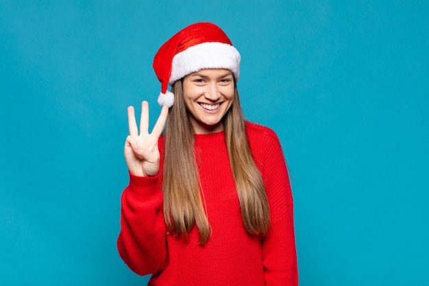 Young pretty woman wearing Christmas clothes