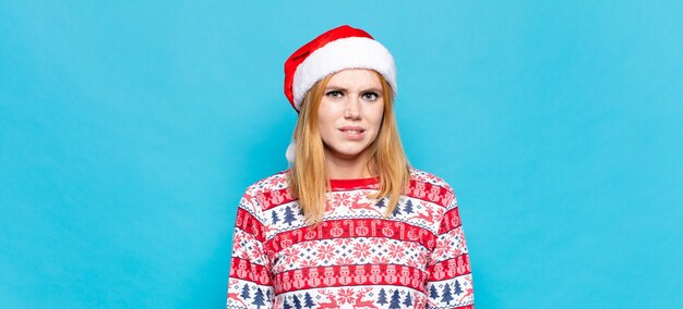 Young pretty woman wearing Christmas clothes