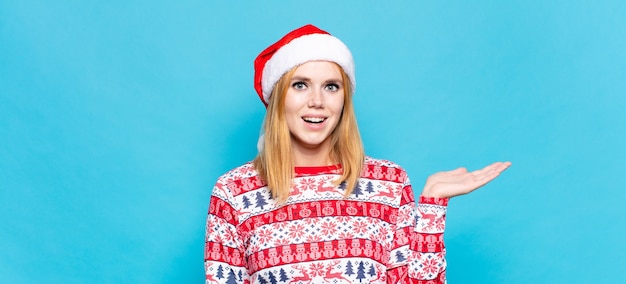 Young pretty woman wearing Christmas clothes