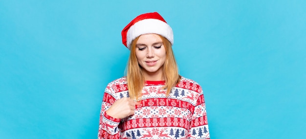 Young pretty woman wearing Christmas clothes