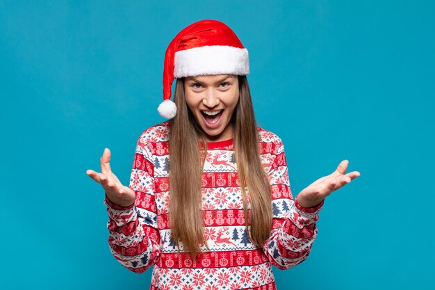 Young pretty woman wearing Christmas clothes