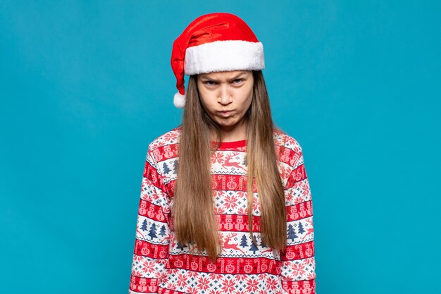 Young pretty woman wearing Christmas clothes