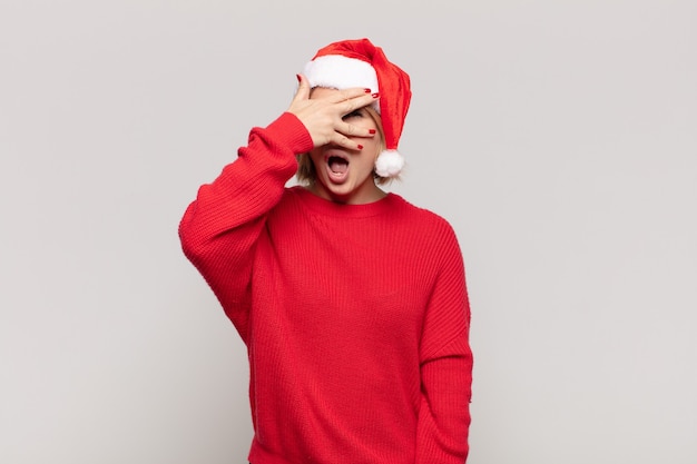 Young pretty woman wearing Christmas clothes