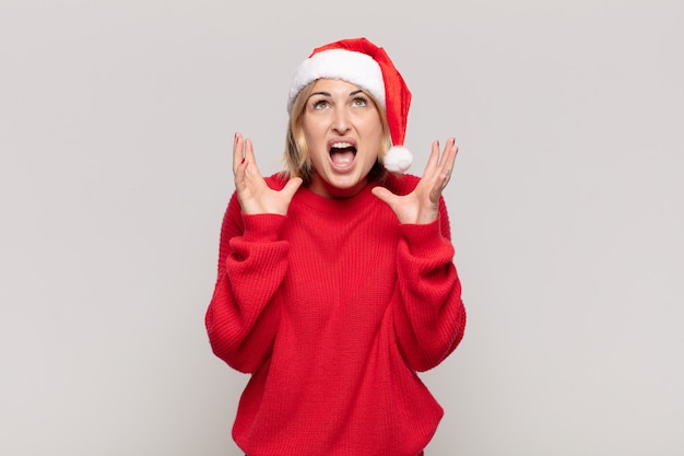 Young pretty woman wearing Christmas clothes