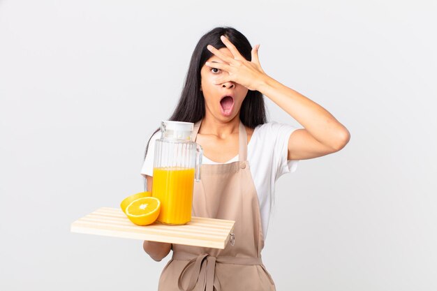 young pretty woman with apron and breakfast concept