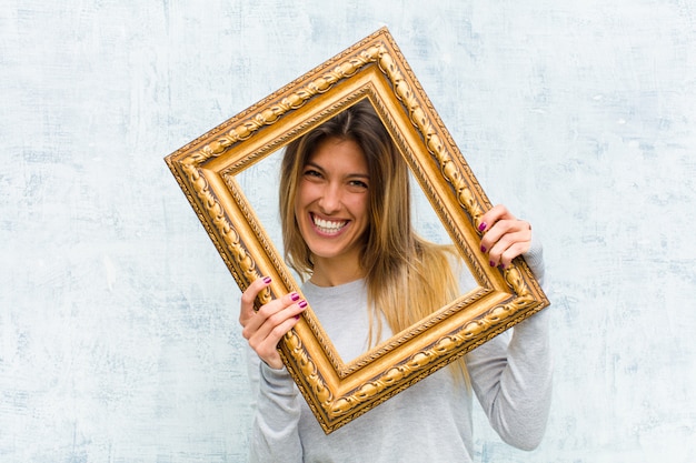 Young pretty woman with a baroque frame