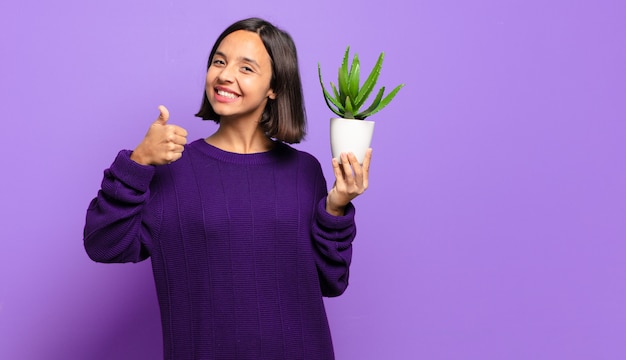 Young pretty woman with a cactus