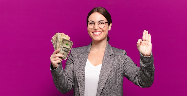 Young pretty woman with dollar banknotes