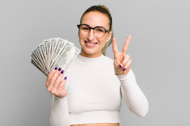 Young pretty woman with dollar banknotes