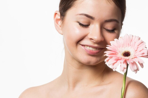 Young pretty woman with flower close up isolated on white hands manicure spa people concept