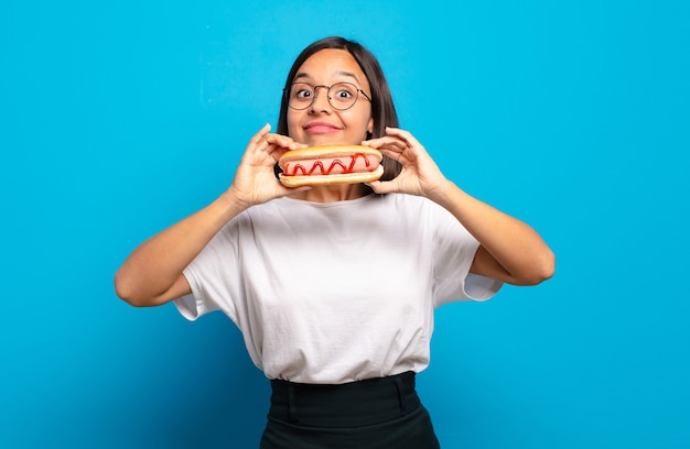 Young pretty woman with a hot dog