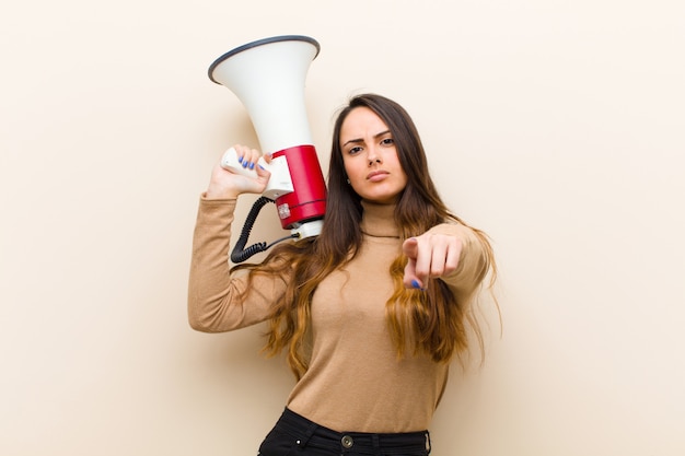 Young pretty woman with a megaphone