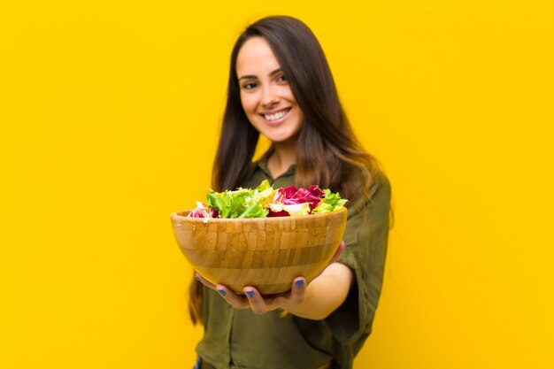 Young pretty woman with a salad.