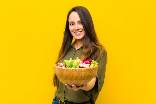 Young pretty woman with a salad.