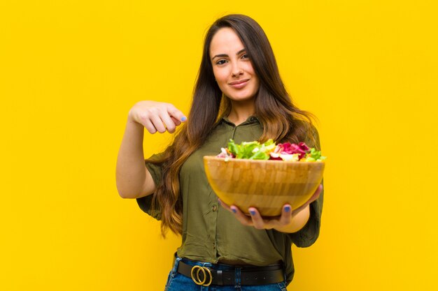 Young pretty woman with a salad.