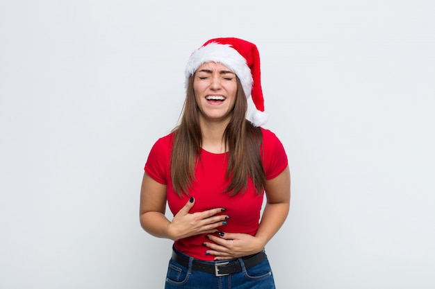 Young pretty woman with santa hat. Christmas concept. 