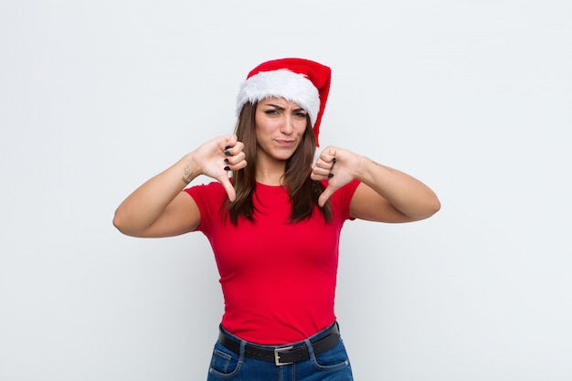 Young pretty woman with santa hat. Christmas concept. 