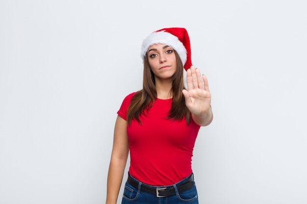 Young pretty woman with santa hat. Christmas concept. 