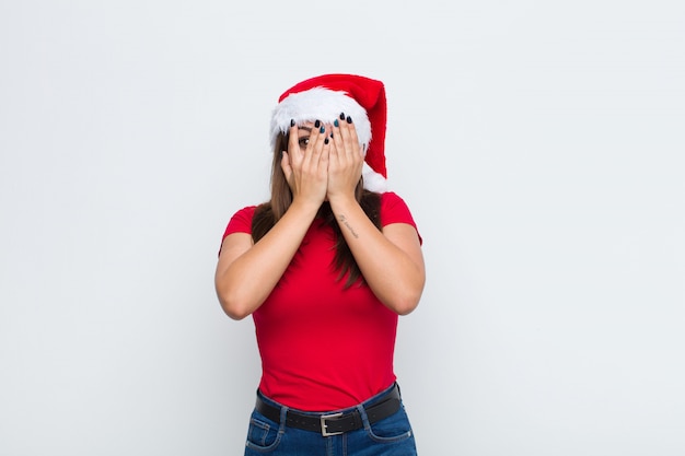 Young pretty woman with santa hat. Christmas concept. 