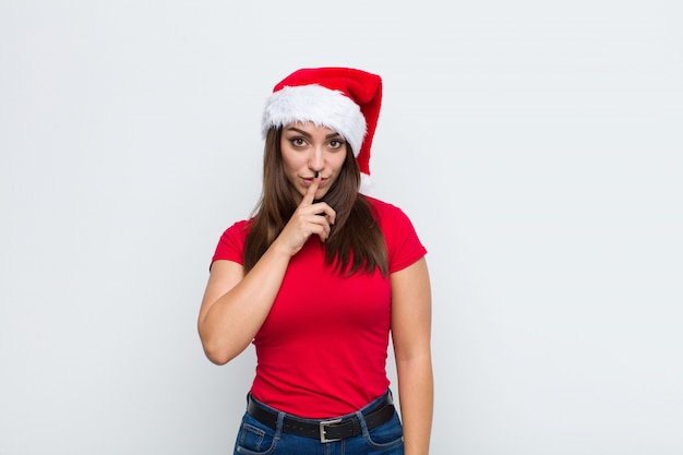 Young pretty woman with santa hat. Christmas concept. 
