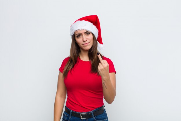 Young pretty woman with santa hat. Christmas concept. 