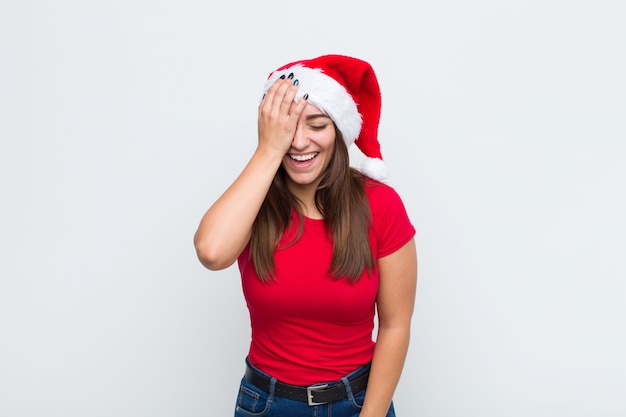 Young pretty woman with santa hat. Christmas concept. 