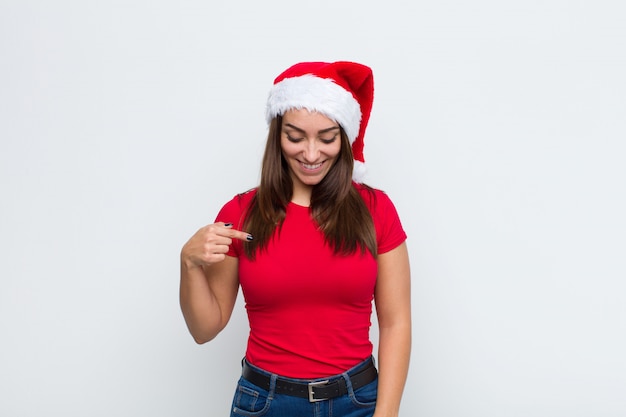 Young pretty woman with santa hat. Christmas concept. 