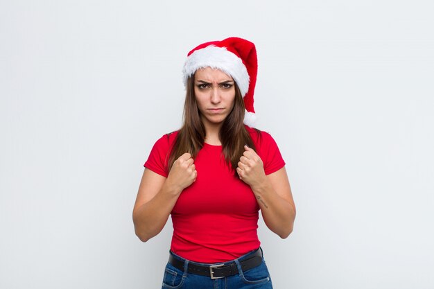 Young pretty woman with santa hat. Christmas concept. 