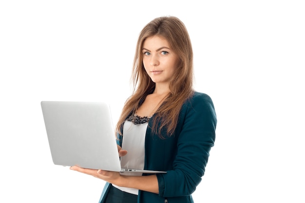 Young prety business girl with laptop in hands looking at the camera isolated on white background
