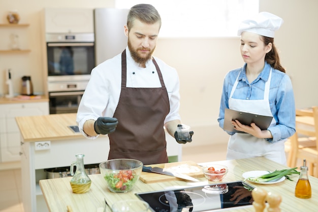 Young Professional Chef Working in Restaurant