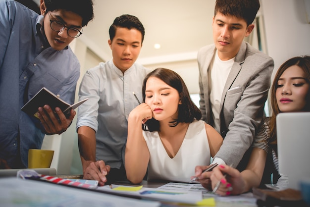 Young professional team discussing business plan in the office