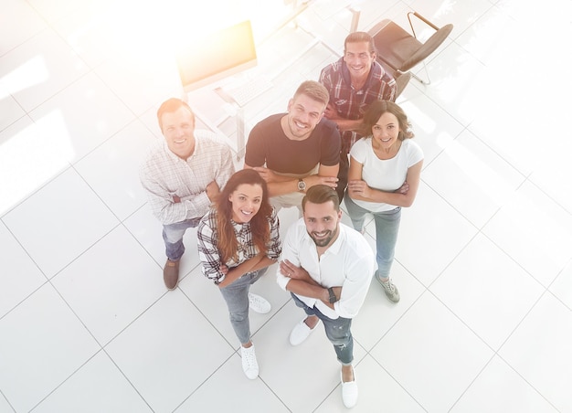 Young professionals standing near the desktop