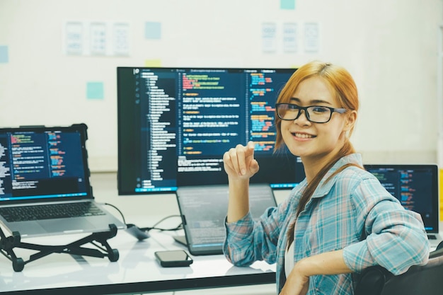 Young programmer or IT specialist satisfied with her work done