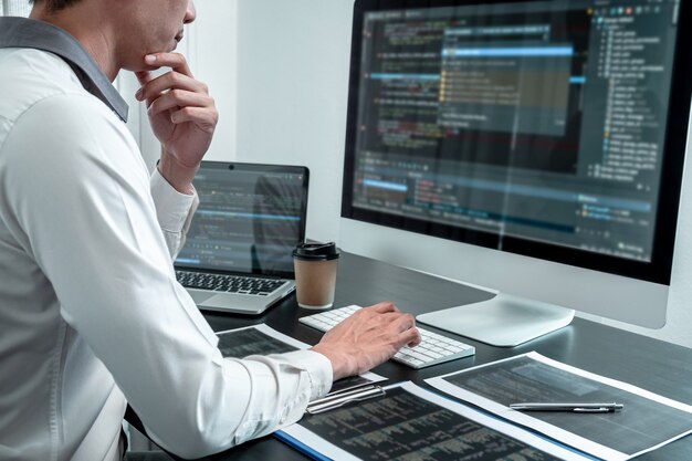 Premium Photo | Professional team of programmer working on project in ...