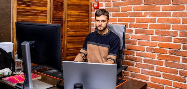 Young programmer at workplace startup business program
development concept