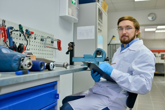 Young Prosthetist  Working in Office