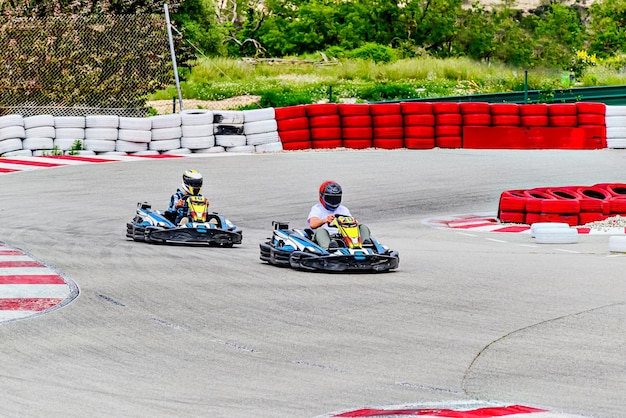young racers competing with karts on a karting circuit in barcelona lifestyle