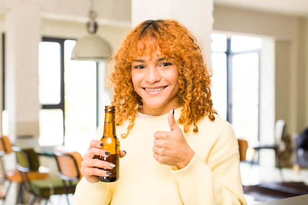 Photo young red hair latin pretty woman having a beer at home