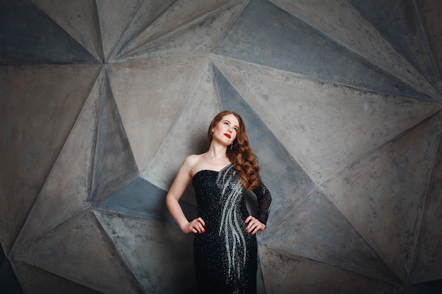 Young Red Hair Woman in Luxury Black Dress