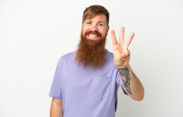 Young reddish caucasian man isolated on white background happy and counting three with fingers