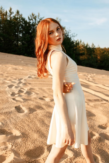 young redhead female with long wavy hair