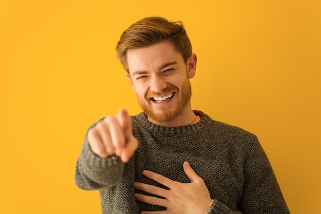 Young redhead man face closeup dreams of achieving goals and purposes