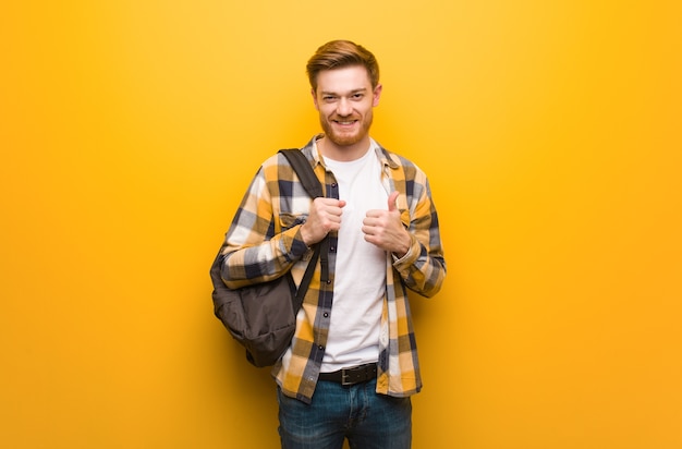 Young redhead man smiling