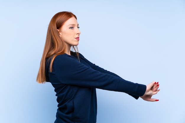 Young redhead sport woman stretching